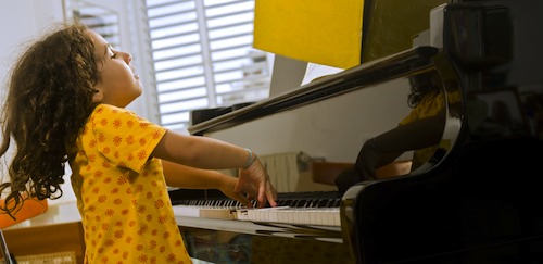 Develop your child's aural skills by combining piano playing with song