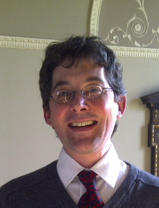 George Bevan helps students sing in tune