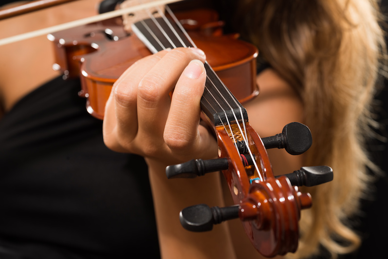 Woman playing her violin