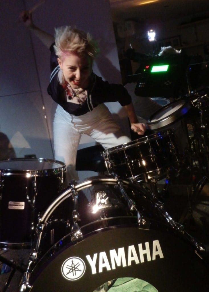 Emily Dolan Davies with drums